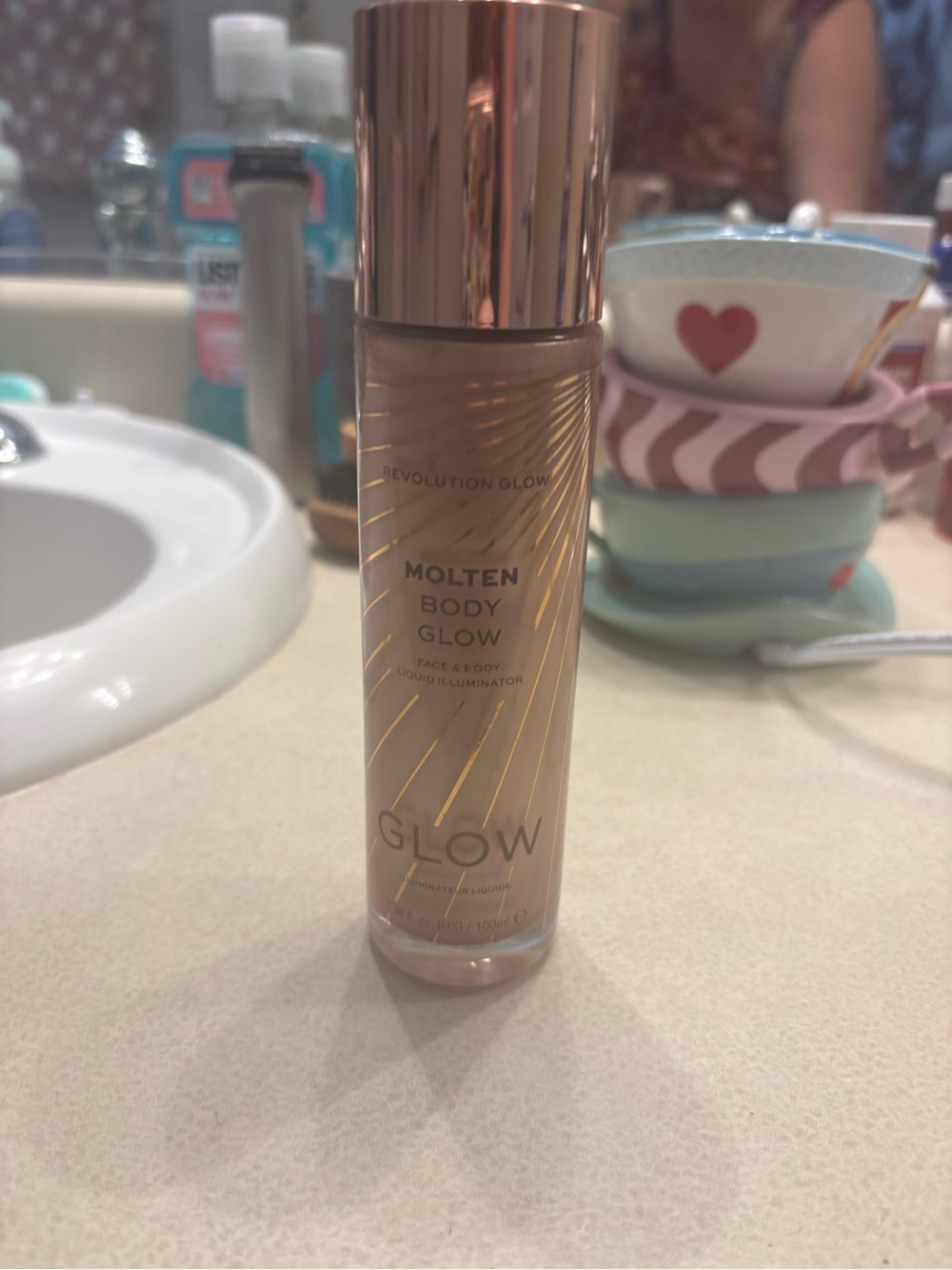 Revolution Molten Body Glow Liquid Illuminator - Rose Gold Bottle